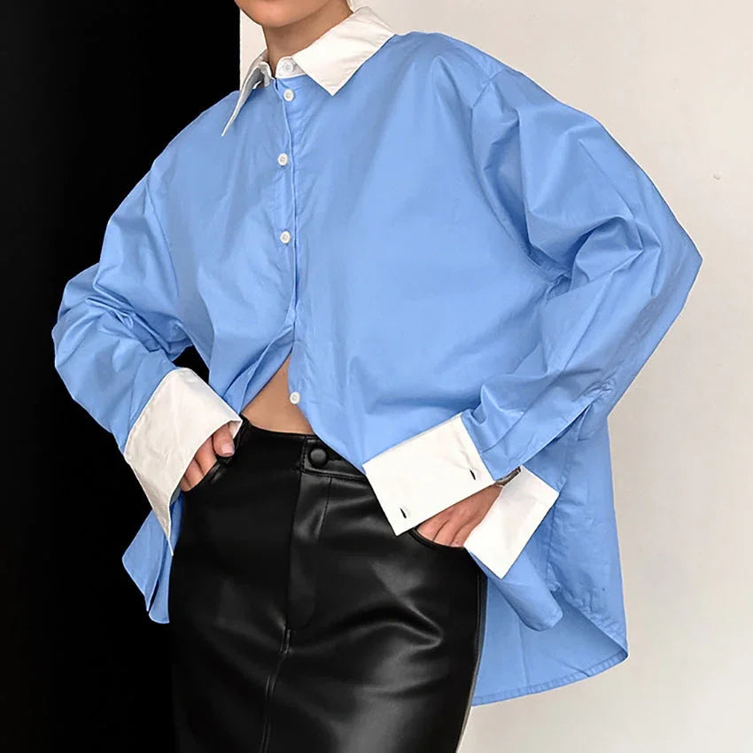 Blue long sleeve women's shirt with white cuffs