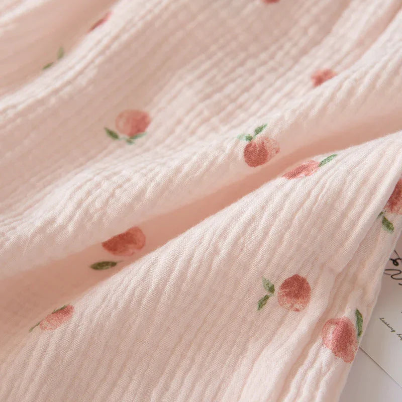 Pink cotton gauze fabric with peach print