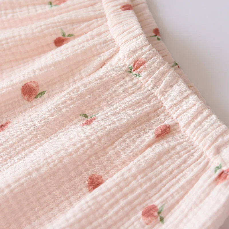 Pink cotton gauze pajama pants with peach print