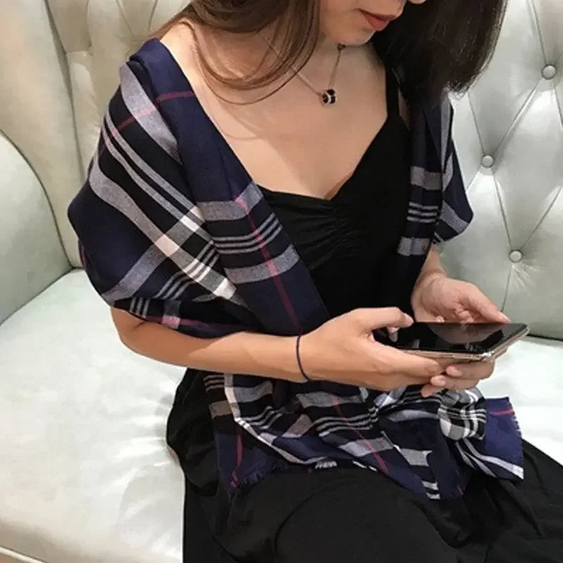 Soft warm checked fashion scarf on woman