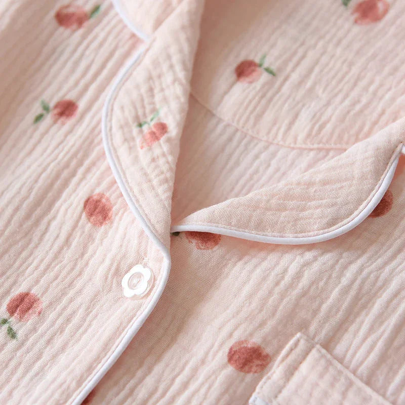 Close-up of pink cotton gauze pajamas with peach print