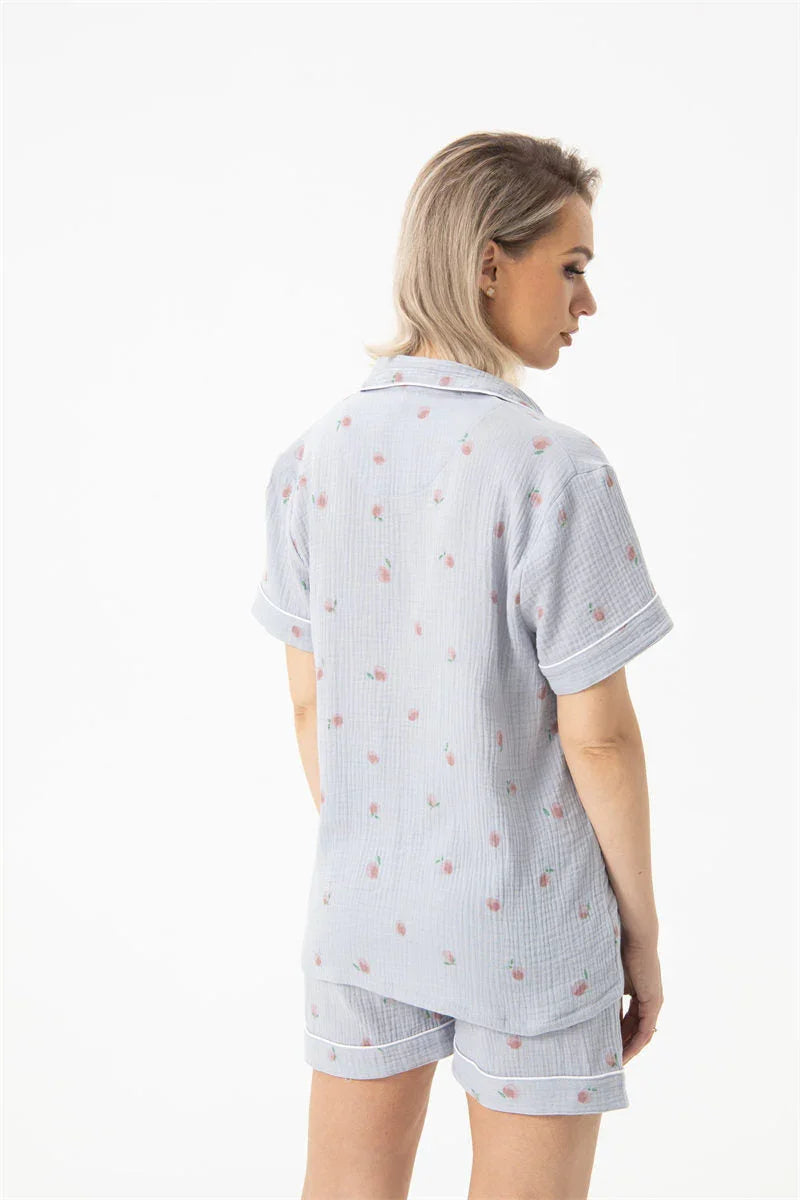 woman wearing light blue cotton gauze pajama set with floral print