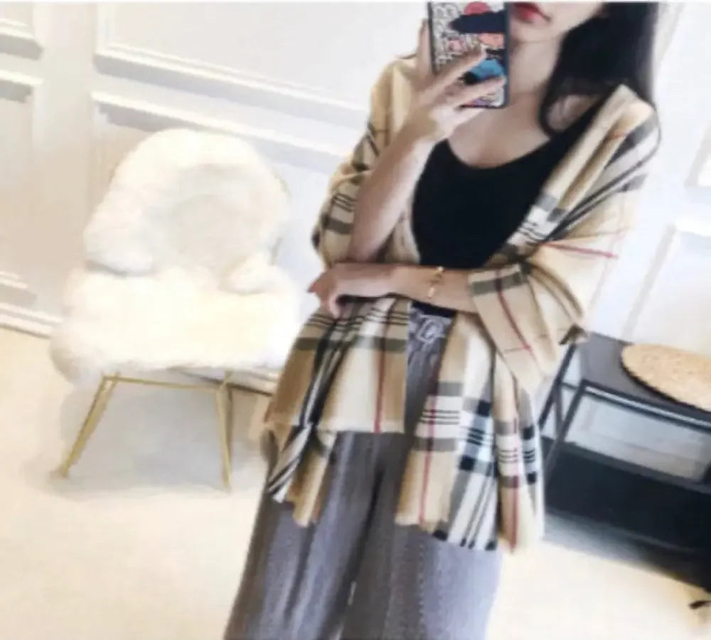 Stylish soft warm checked fashion scarf on woman